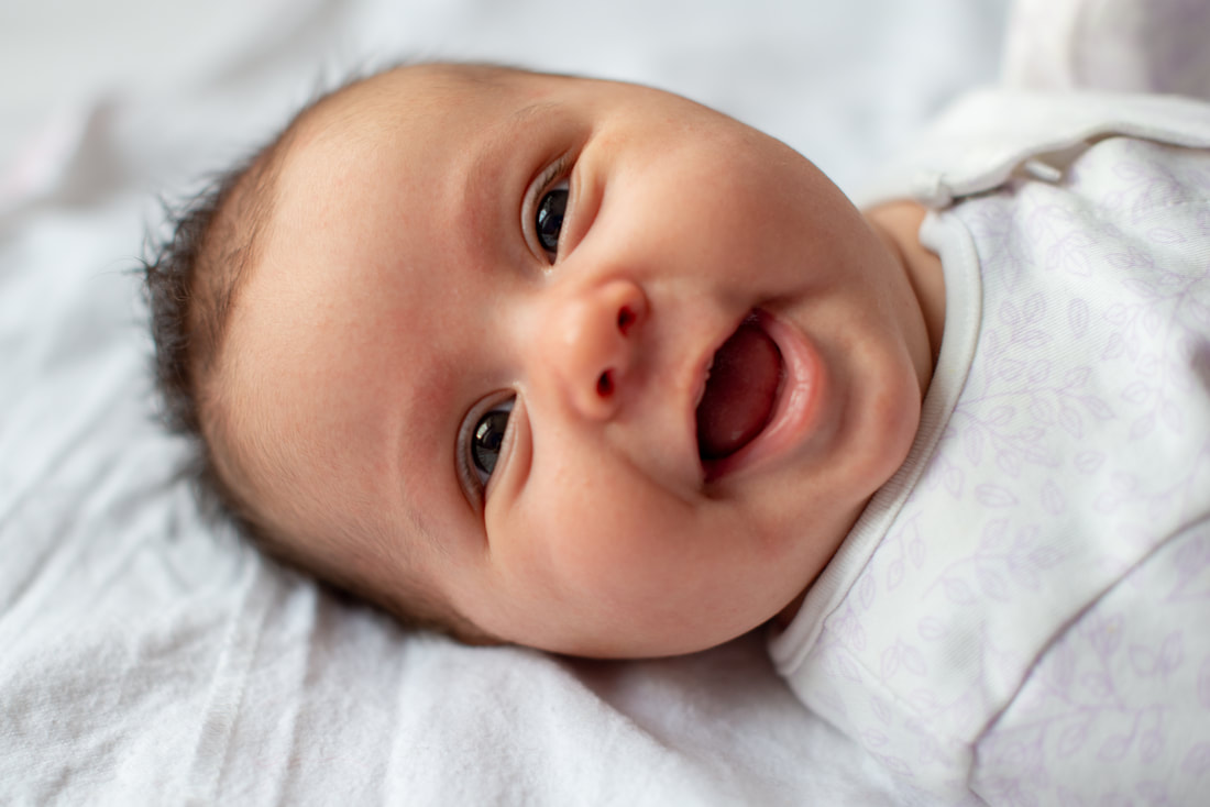 A child smiling after receiving chiropractic care to improve their sleep and digestion.